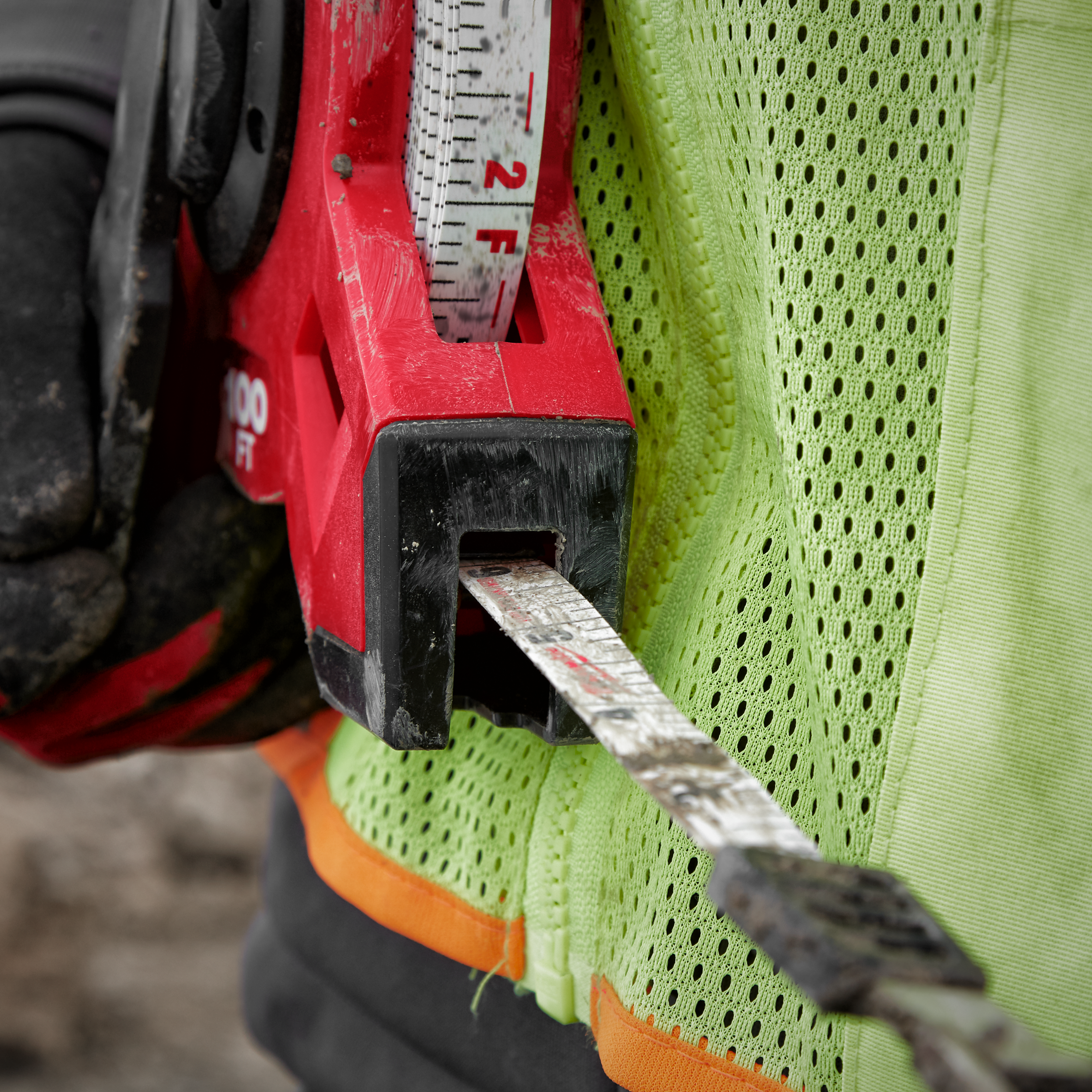 Close up of a red tape measure in a work environment