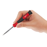 Hand holding a screwdriver with a red handle on a white background
