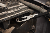 Milwaukee tool on a mechanical surface with visible branding