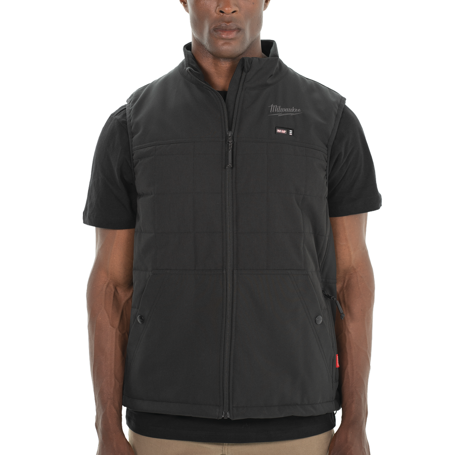 Person wearing a black Milwaukee vest
