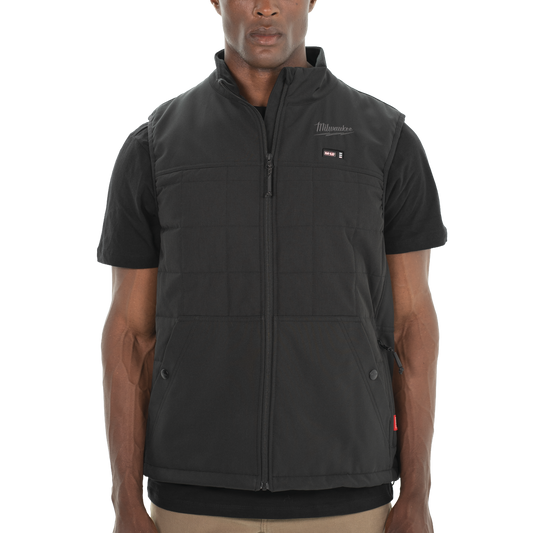 Person wearing a black Milwaukee vest