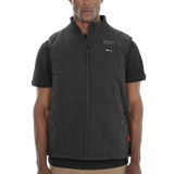Person wearing a black Milwaukee vest
