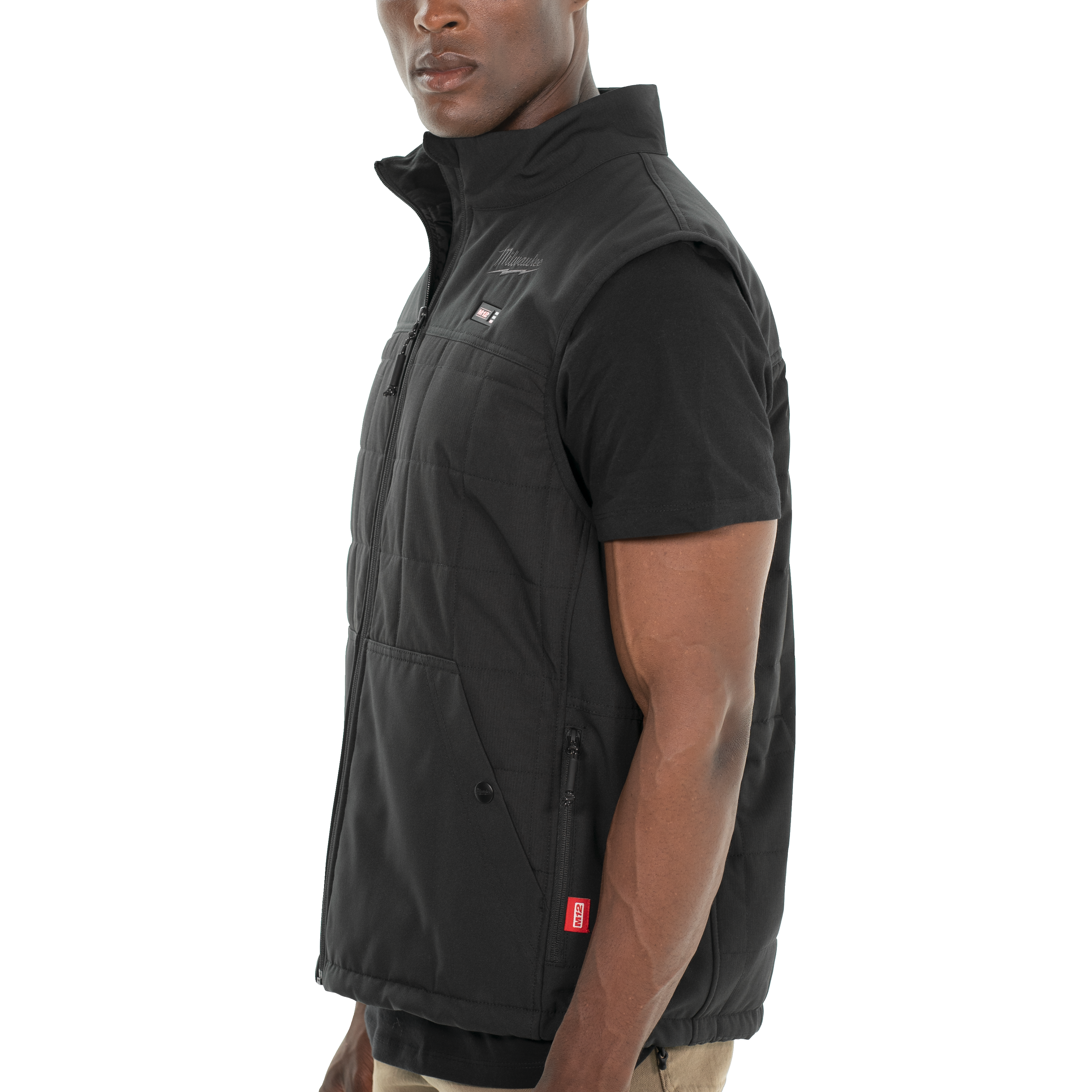 Man wearing a black vest over a black shirt